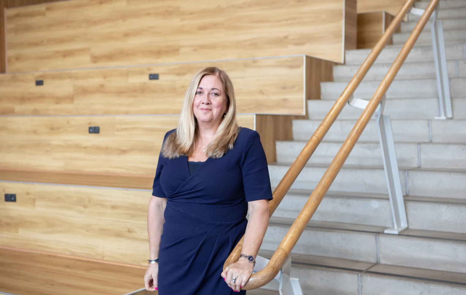 Jeanette Evans, Vice Principal of Operations at Glasgow Kelvin College, standing beside a staircase in the college’s modern lecture space Jeanette Evans, Vice Principal of Operations at Glasgow Kelvin College, standing beside a staircase in the college’s modern lecture space