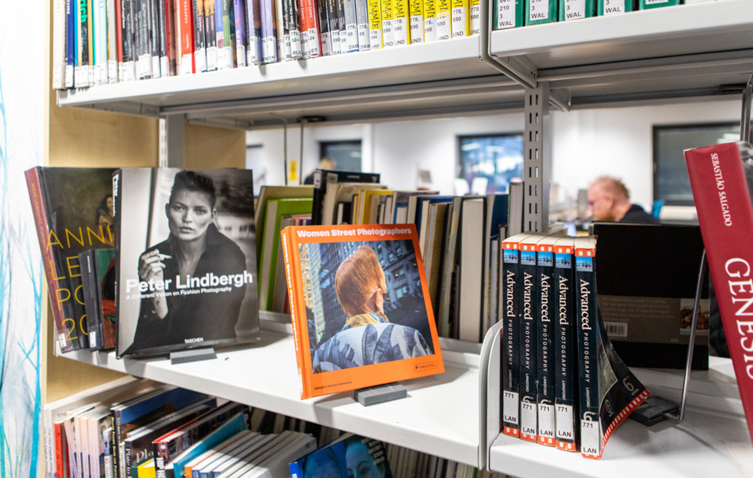 Close-up of photography books on display in the Easterhouse campus library at Glasgow Kelvin College, including titles like Peter Lindbergh and Women Street Photographers.