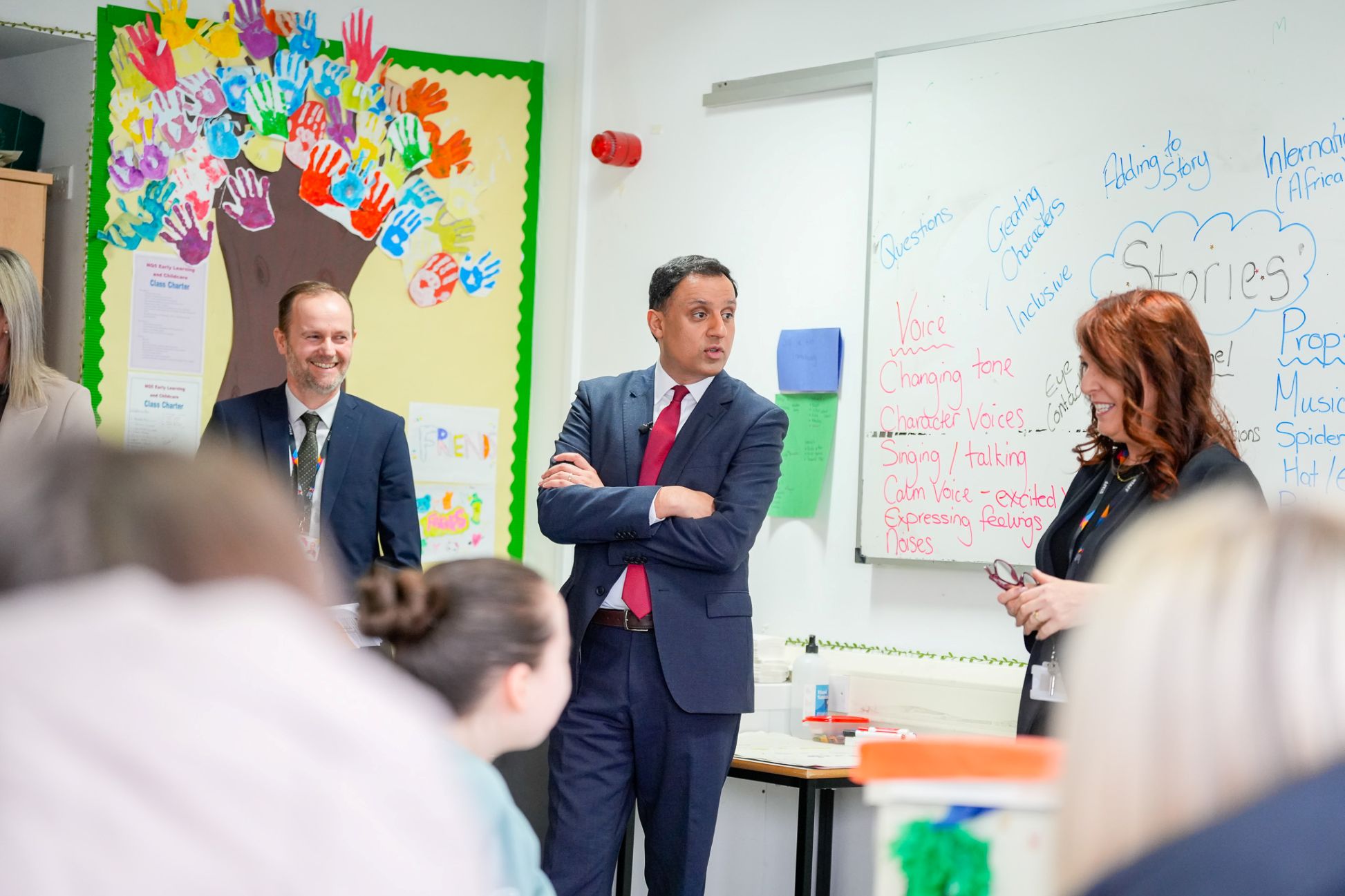 Anas Sarwar speaking with staff and students during visit to childcare class at Glasgow Kelvin College.