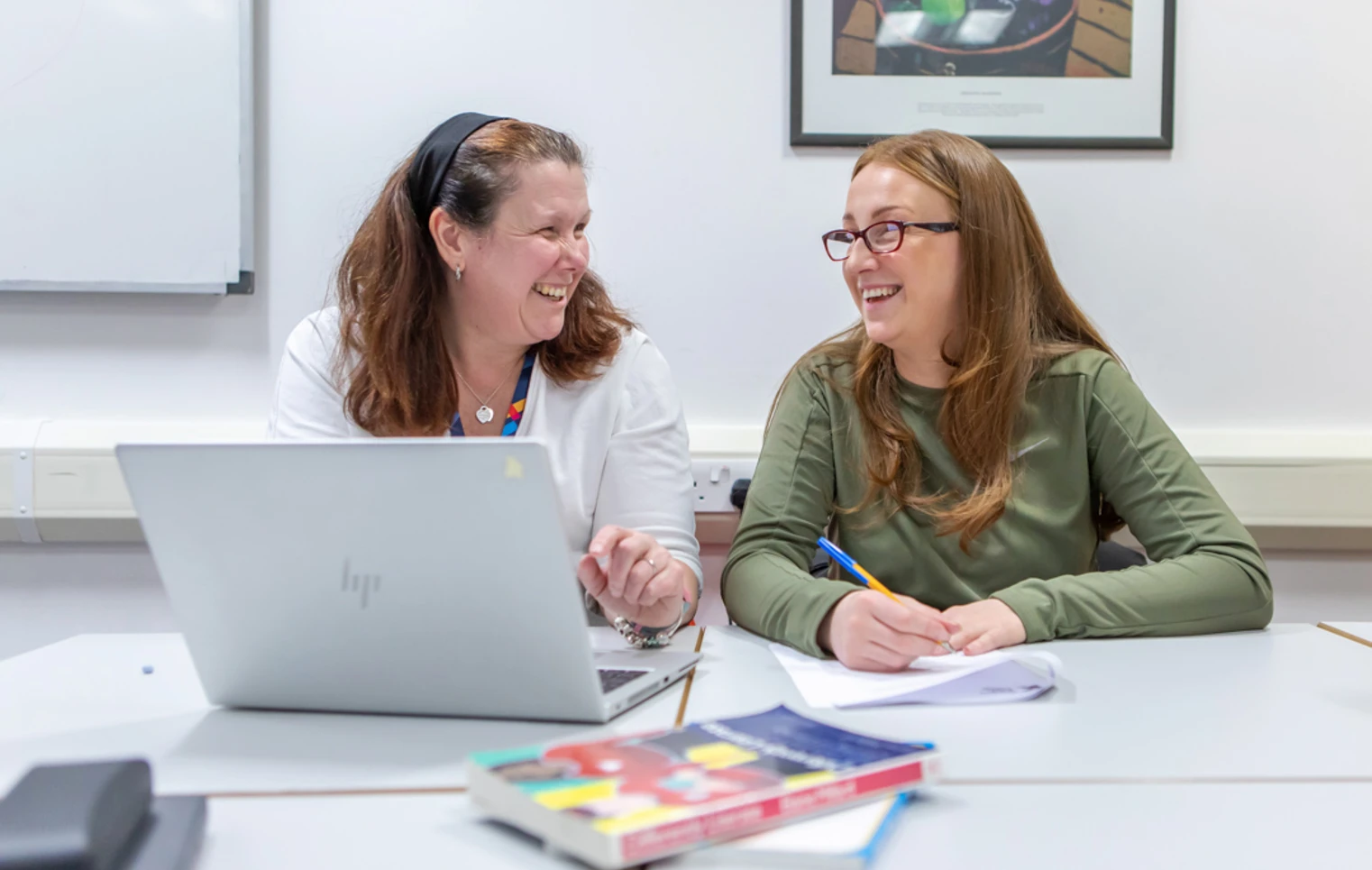 A joyful interaction captured between a Glasgow Kelvin College lecturer and student, emphasising the positive, welcoming learning environment. A joyful interaction captured between a Glasgow Kelvin College lecturer and student, emphasising the positive, welcoming learning environment.