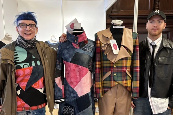 Glasgow Kelvin students Evy Craig and Craig Watson standing proudly beside their award-winning fashion designs at Craftex 2025. Glasgow Kelvin students Evy Craig and Craig Watson standing proudly beside their award-winning fashion designs at Craftex 2025.