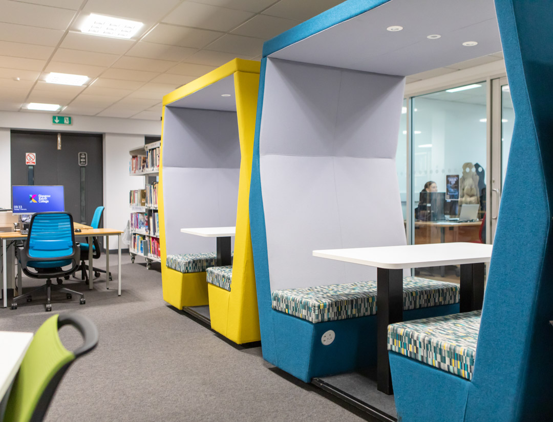Colourful study pods and computer workstations in the Library and Flexible Learning Centre at Glasgow Kelvin College’s Easterhouse campus.