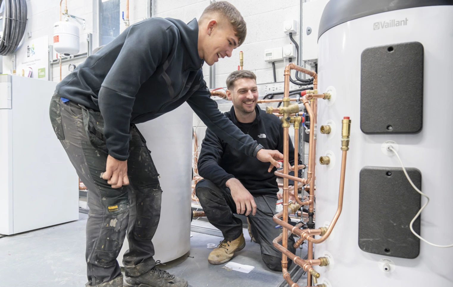 Student working on a plumbing installation board with copper pipes at Glasgow Kelvin College as part of the Green Academy training programme. Student working on a plumbing installation board with copper pipes at Glasgow Kelvin College as part of the Green Academy training programme.