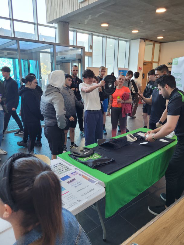 Students at Glasgow Kelvin College gathered in the campus atrium, taking part in a weightlifting challenge and interactive stall for National Fitness Day.