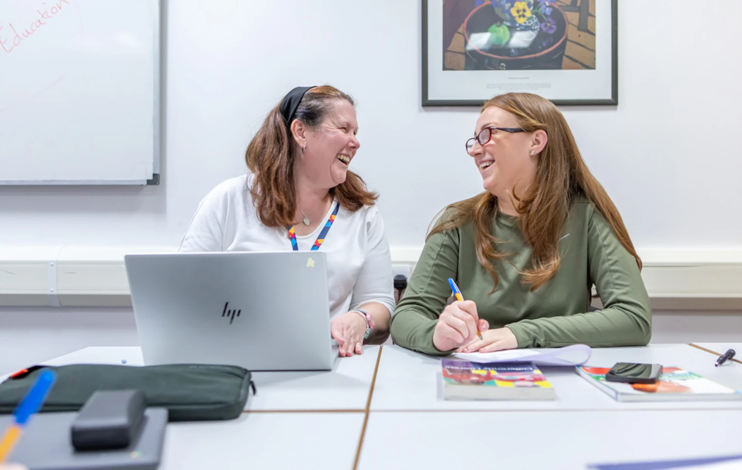 A cheerful moment between lecturer and student at Glasgow Kelvin College, showcasing supportive relationships and engaging one-to-one learning. A cheerful moment between lecturer and student at Glasgow Kelvin College, showcasing supportive relationships and engaging one-to-one learning.